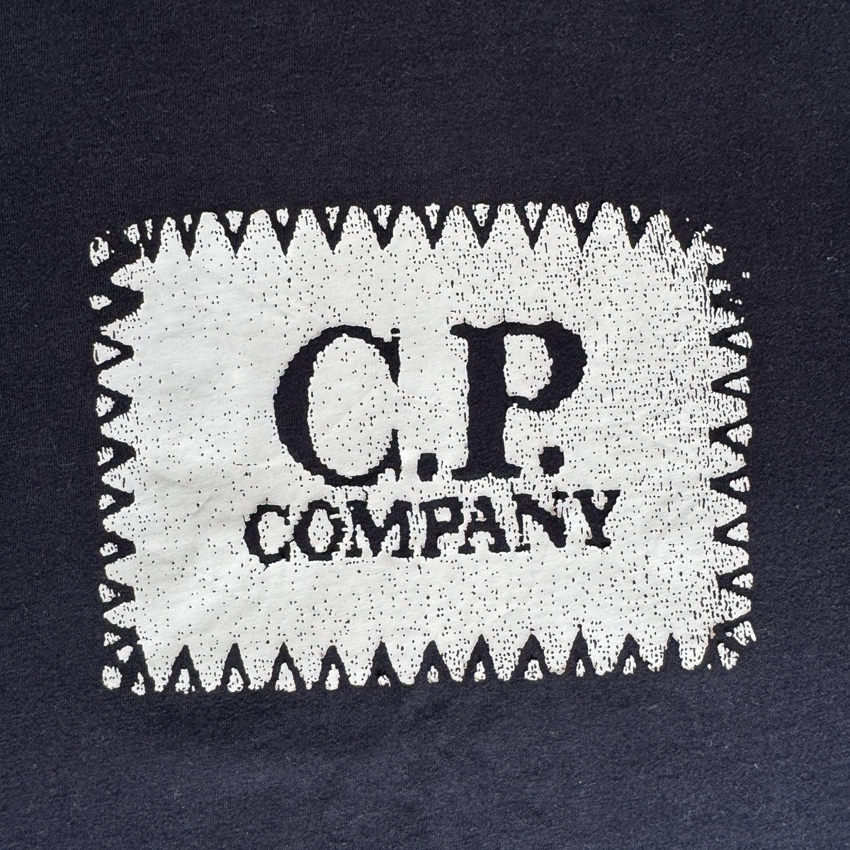 C.P. Company navy t-shirt with stamped logo and soft cotton material.