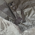 Stone Island black nylon metal Watro jacket with logo badge and visible wear marks.