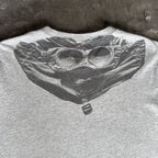 C.P. Company grey t-shirt featuring distinctive goggle print and logo detail.
