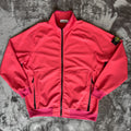 Stone Island fuchsia track jacket with logo badge and stretch nylon material.
