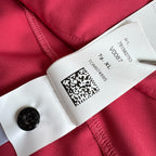 Stone Island fuchsia track jacket with logo badge and stretch nylon material.